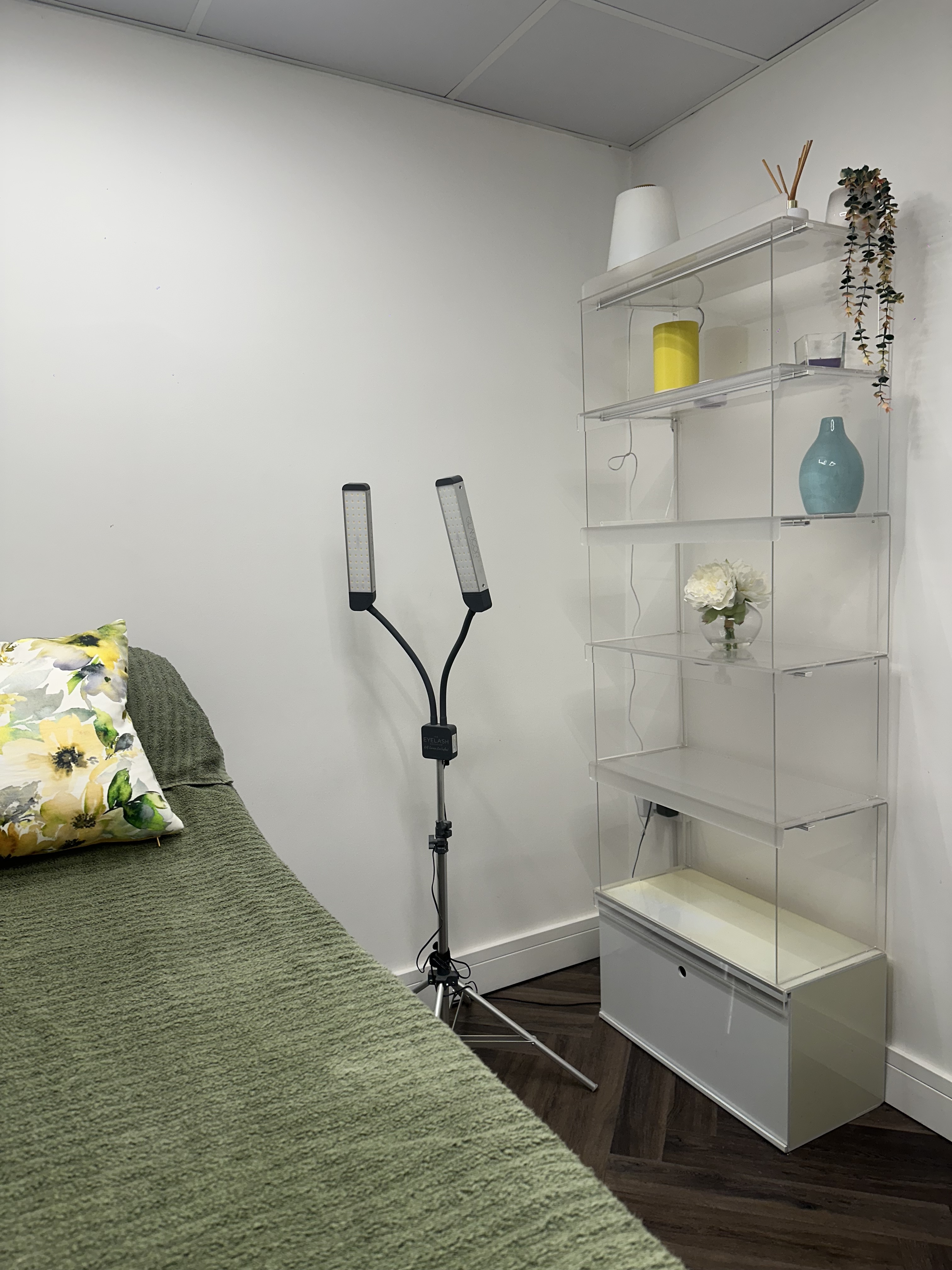 The twin lash lamp and white shelving in the Radiant by Fran treatment room